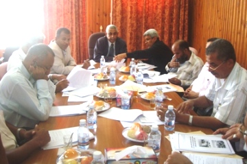 Omaier chairs a meeting for  Local water and santation Board of Directs  