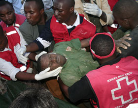Two dead, 20 others trapped in a building